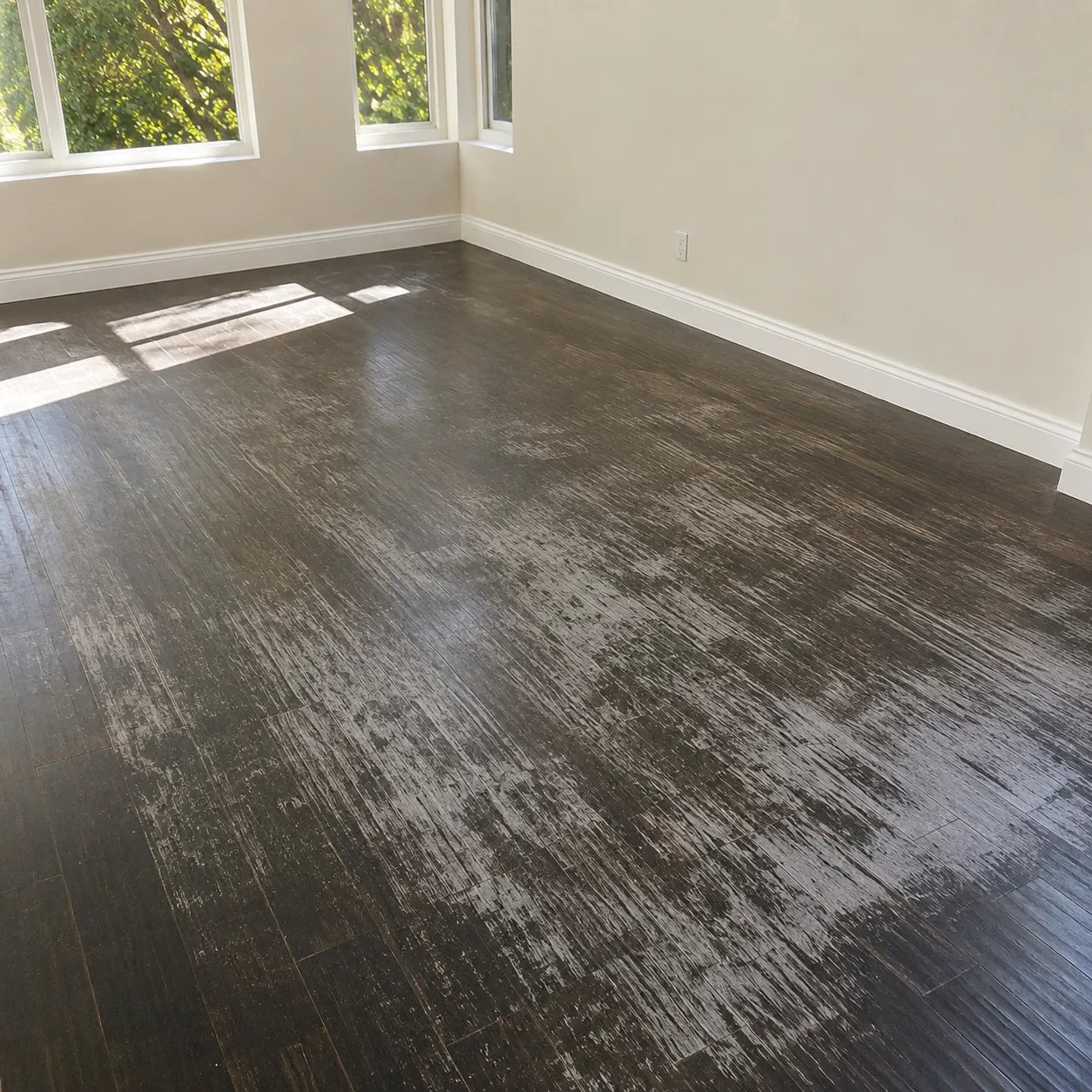 Before hardwood floor cleaning in Rosenberg showing dirt and worn-looking flooring Before hardwood floor cleaning in Rosenberg showing dirt and worn-looking flooring